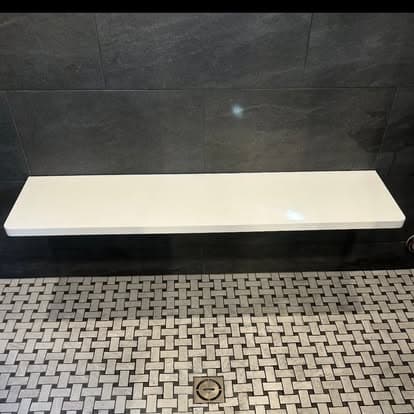 Dark slate shower with basketweave marble floor